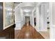 Hallway features hardwood floors and white molding leading to the living areas at 155 Carrolls Way, Fayetteville, GA 30215