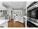 Beautiful kitchen with white cabinets, stainless steel appliances, and adjacent dining area at 155 Carrolls Way, Fayetteville, GA 30215