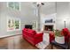 Living room featuring high ceilings, large windows, fireplace, and hardwood floors at 155 Carrolls Way, Fayetteville, GA 30215