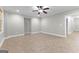 Open living area featuring a ceiling fan, recessed lighting, neutral walls, and tile flooring at 155 Carrolls Way, Fayetteville, GA 30215