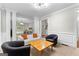 Inviting living room with a comfortable seating arrangement and contemporary design at 155 Carrolls Way, Fayetteville, GA 30215