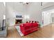 Bright living room featuring a brick fireplace, hardwood floors, and vaulted ceilings at 155 Carrolls Way, Fayetteville, GA 30215