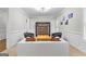 Open-concept living area with stylish seating, neutral walls, and hardwood floors at 155 Carrolls Way, Fayetteville, GA 30215