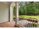 Close up view of a front porch with red brick flooring and flower boxes at 155 Carrolls Way, Fayetteville, GA 30215