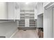 Large walk-in closet with multiple shelving and drawer units for optimal storage and organization at 155 Carrolls Way, Fayetteville, GA 30215