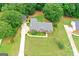 Aerial view of a home showcasing its large lot, mature trees, and well-maintained landscaping at 344 Mckibben Dr, Locust Grove, GA 30248