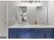 Bright bathroom features double vanity with blue cabinets and countertop at 344 Mckibben Dr, Locust Grove, GA 30248