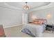 Bright bedroom boasts tray ceilings, neutral walls, and ample natural light at 344 Mckibben Dr, Locust Grove, GA 30248