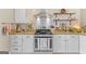 Beautiful kitchen with stainless steel appliances, granite countertops and tile backsplash at 344 Mckibben Dr, Locust Grove, GA 30248