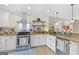 Spacious kitchen featuring granite countertops, stainless appliances and ample cabinet space at 344 Mckibben Dr, Locust Grove, GA 30248
