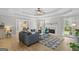 Spacious living room featuring modern furniture, hardwood floors, and a cozy fireplace at 344 Mckibben Dr, Locust Grove, GA 30248