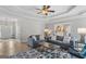 Inviting living room with comfortable seating, a stylish rug, and lots of natural light at 344 Mckibben Dr, Locust Grove, GA 30248