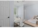 Bathroom with a corner soaking tub, double sinks, and modern finishes at 320 Cobb Ct, Hampton, GA 30228