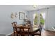 Comfortable dining room with wood table, french doors, and natural light at 320 Cobb Ct, Hampton, GA 30228