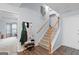 Welcoming foyer with hardwood floors, stairway, coat rack, and ample space at 320 Cobb Ct, Hampton, GA 30228