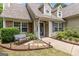 Inviting front entrance with a bench, stepping stones, and landscaping leading to the front door at 320 Cobb Ct, Hampton, GA 30228