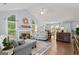 Spacious open-concept living room with vaulted ceiling, fireplace, and hardwood floors at 320 Cobb Ct, Hampton, GA 30228