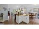 Spacious open-concept living space with kitchen island, dining area, and living room at 320 Cobb Ct, Hampton, GA 30228