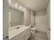 The full bathroom features a white vanity with a sink, toilet, and shower-tub combination at 2047 Gazebo Ln, Snellville, GA 30078