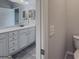 Modern bathroom with white cabinets and a marble countertop at 2047 Gazebo Ln, Snellville, GA 30078