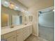 Bright bathroom with double sinks, marble countertops, and large mirror at 2047 Gazebo Ln, Snellville, GA 30078