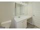 This bathroom features a white vanity with a sink and a large mirror with modern lighting at 2047 Gazebo Ln, Snellville, GA 30078