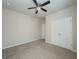 Spacious bedroom features neutral walls, carpet, ceiling fan, and a closet at 2047 Gazebo Ln, Snellville, GA 30078