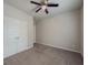 A clean bedroom with a ceiling fan and big closet at 2047 Gazebo Ln, Snellville, GA 30078