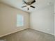 Well-lit bedroom features a ceiling fan and large window at 2047 Gazebo Ln, Snellville, GA 30078