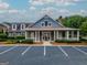 The community clubhouse features a stone chimney, inviting front porch, and convenient parking at 2047 Gazebo Ln, Snellville, GA 30078