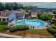 The community pool is surrounded by lush landscaping and ample seating, perfect for relaxing at 2047 Gazebo Ln, Snellville, GA 30078