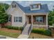 Charming brick and siding home with landscaped front yard and inviting front porch at 2047 Gazebo Ln, Snellville, GA 30078