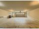 An oversized garage with a garage door and access door, with lots of space for parking and storage at 2047 Gazebo Ln, Snellville, GA 30078