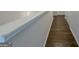 A nicely lit hallway with wood floors and white trim at 2047 Gazebo Ln, Snellville, GA 30078