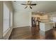 Bright, open kitchen with stainless steel appliances, an island, hardwood floors, and natural light from several windows at 2047 Gazebo Ln, Snellville, GA 30078