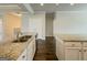 The kitchen boasts white cabinets and granite countertops at 2047 Gazebo Ln, Snellville, GA 30078