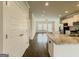 Open living area flows into a bright kitchen with stainless steel appliances at 2047 Gazebo Ln, Snellville, GA 30078