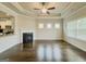 Open living area features a fireplace, tray ceilings, and hardwood floors at 2047 Gazebo Ln, Snellville, GA 30078