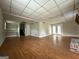 Spacious basement with wood-look floors, recessed lighting, storage shelves and double doors at 1486 Harbour Oaks Rd, Tucker, GA 30084