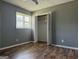 Bedroom with wood floors, window, and closet at 1486 Harbour Oaks Rd, Tucker, GA 30084