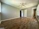 Bedroom with wood floors, window, and ceiling fan at 1486 Harbour Oaks Rd, Tucker, GA 30084