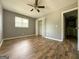 Bedroom with wood floors, window, and closet at 1486 Harbour Oaks Rd, Tucker, GA 30084