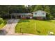 Charming two-story brick home with a well-manicured lawn and covered parking at 1486 Harbour Oaks Rd, Tucker, GA 30084