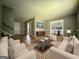 Inviting living room featuring hardwood floors, modern furniture, and an open concept design at 1486 Harbour Oaks Rd, Tucker, GA 30084