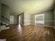 Spacious open-concept living room featuring hardwood floors and ample natural light at 1486 Harbour Oaks Rd, Tucker, GA 30084