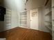 Storage room with shelving, wood-look floors and a door at 1486 Harbour Oaks Rd, Tucker, GA 30084