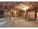 An unfinished basement with exposed wooden framing and a concrete slab floor at 185 Stewart Glen Dr, Covington, GA 30014