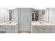Bathroom with double sink vanity, door and natural lighting at 185 Stewart Glen Dr, Covington, GA 30014