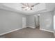 Bedroom features neutral walls, carpet and ensuite bath entrance at 185 Stewart Glen Dr, Covington, GA 30014
