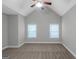 Bright bedroom features neutral walls, carpet, two windows, ceiling fan at 185 Stewart Glen Dr, Covington, GA 30014